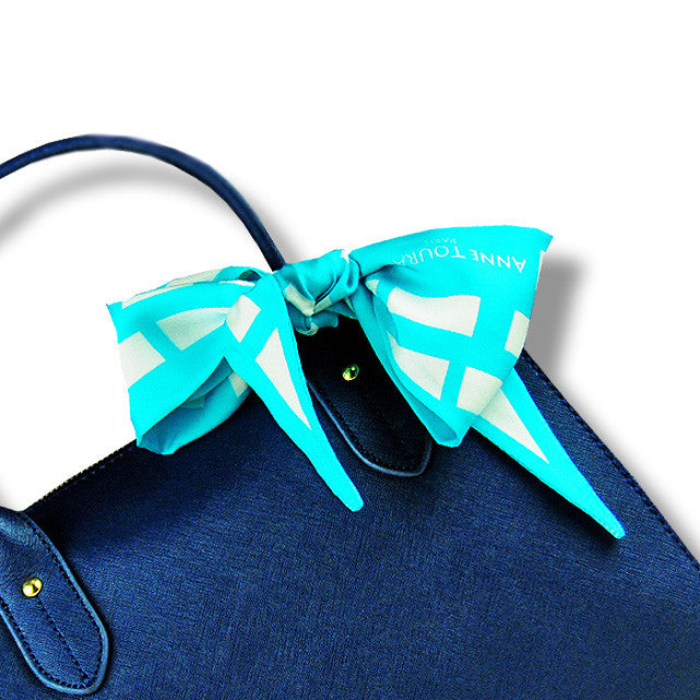 blue & white cannes silk twilly 39x4" by ANNE TOURAINE Paris™ – styled in the hair