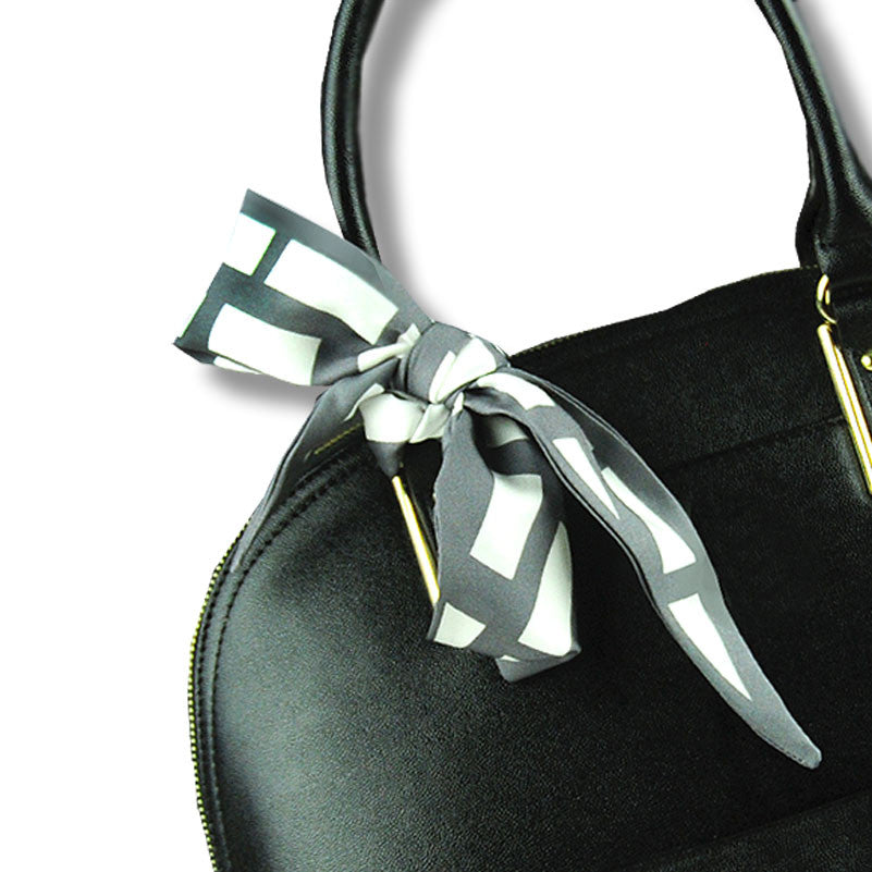 grey & white cannes silk twilly 39x4" by ANNE TOURAINE Paris™ – styled in the hair