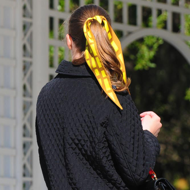 brown & yellow cannes silk twilly 39x4" by ANNE TOURAINE Paris™ – styled in the hair