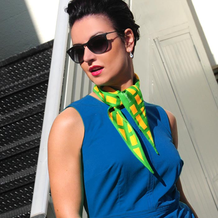 green & orange cannes silk twilly 39x4" by ANNE TOURAINE Paris™ – styled in the hair