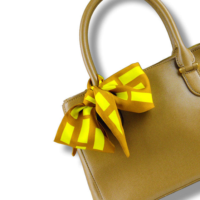 brown & yellow cannes silk twilly 39x4" by ANNE TOURAINE Paris™ – styled in the hair
