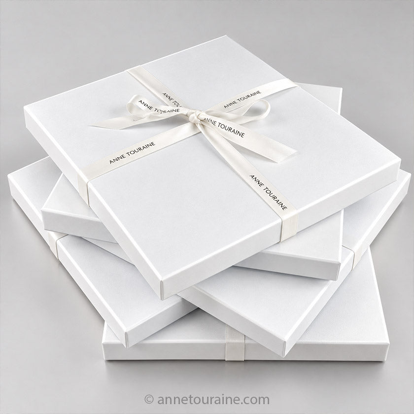 Image of Anne Touraine Paris signature gift boxes, where the French silk scarves bought by customers are packed.