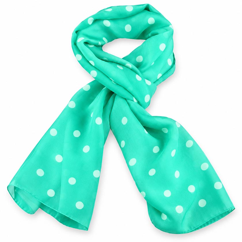 A  turquoise silk chiffon stole with white polka dots is presented with a loose knot on a white background, by Anne Touraine Paris.