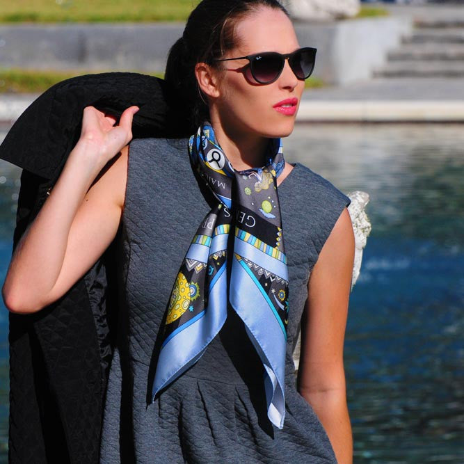 Astrology blue scarf featuring the twelve zodiac signs by ANNE TOURAINE Paris™ scarves tied as a neck scarf